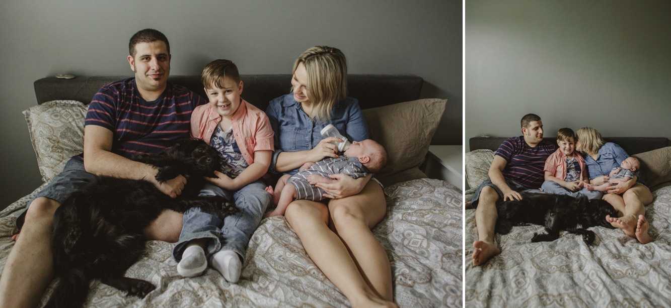 Mom, Dad, little boys and family dog are on the bed during a newborn session in Spring Hill, Tennessee.