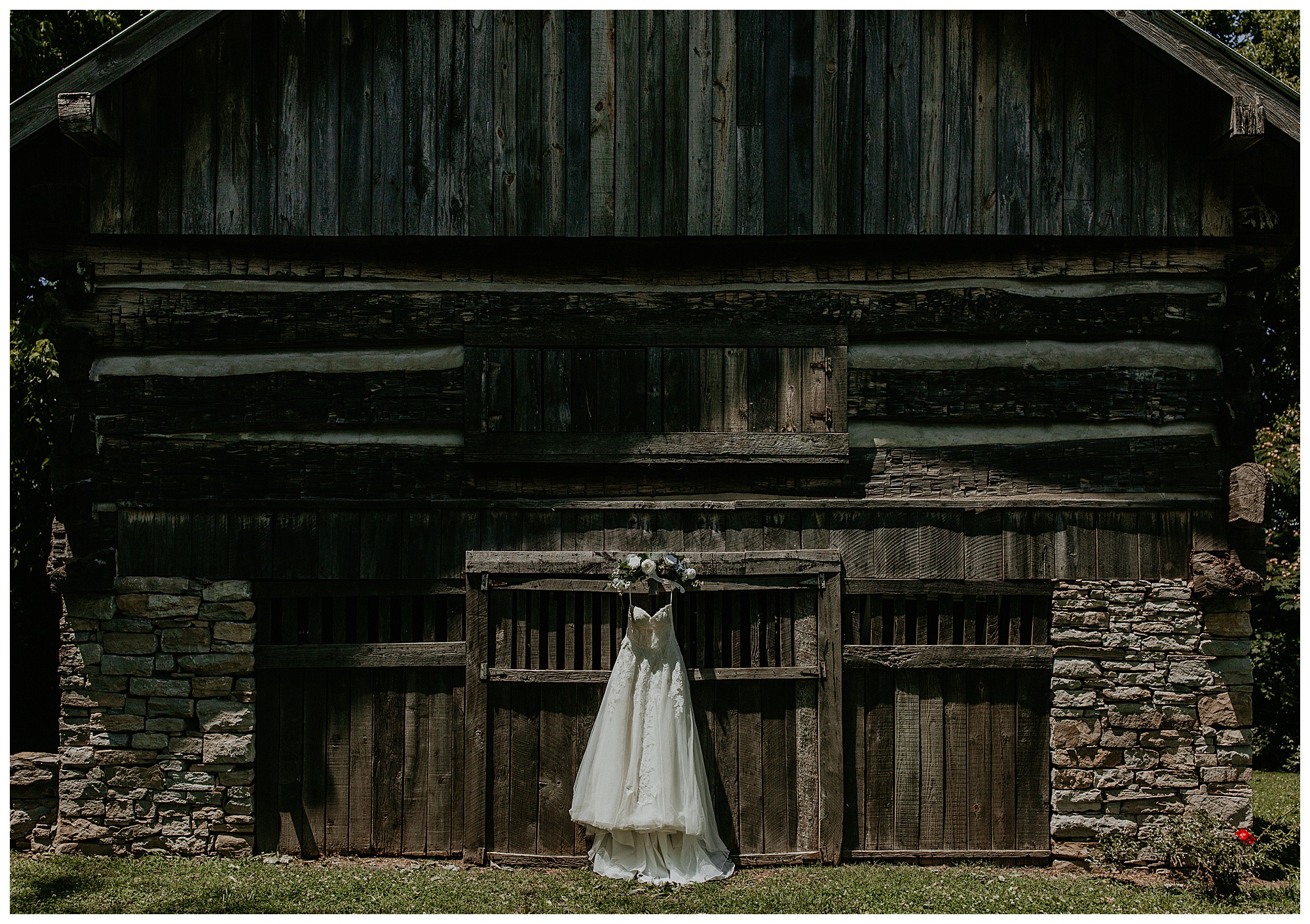 Lauren's wedding dress hangs on the barn door at Cool Springs House.