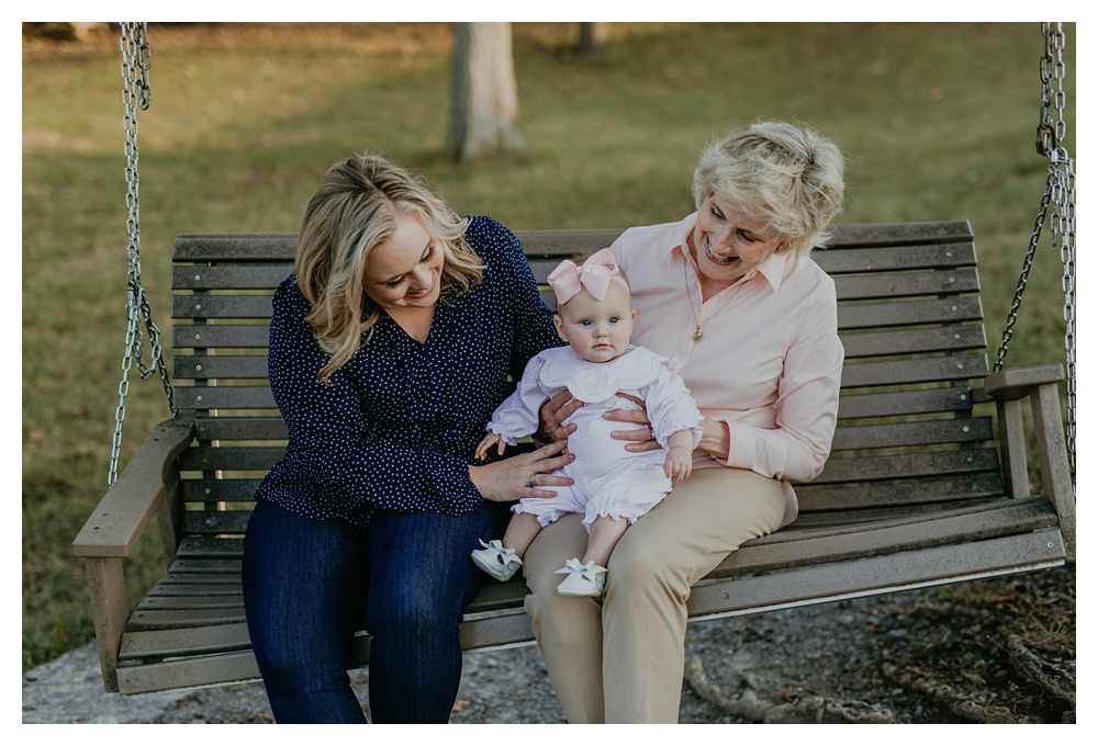 mom and grandma holding baby girl by Nashville family photographer