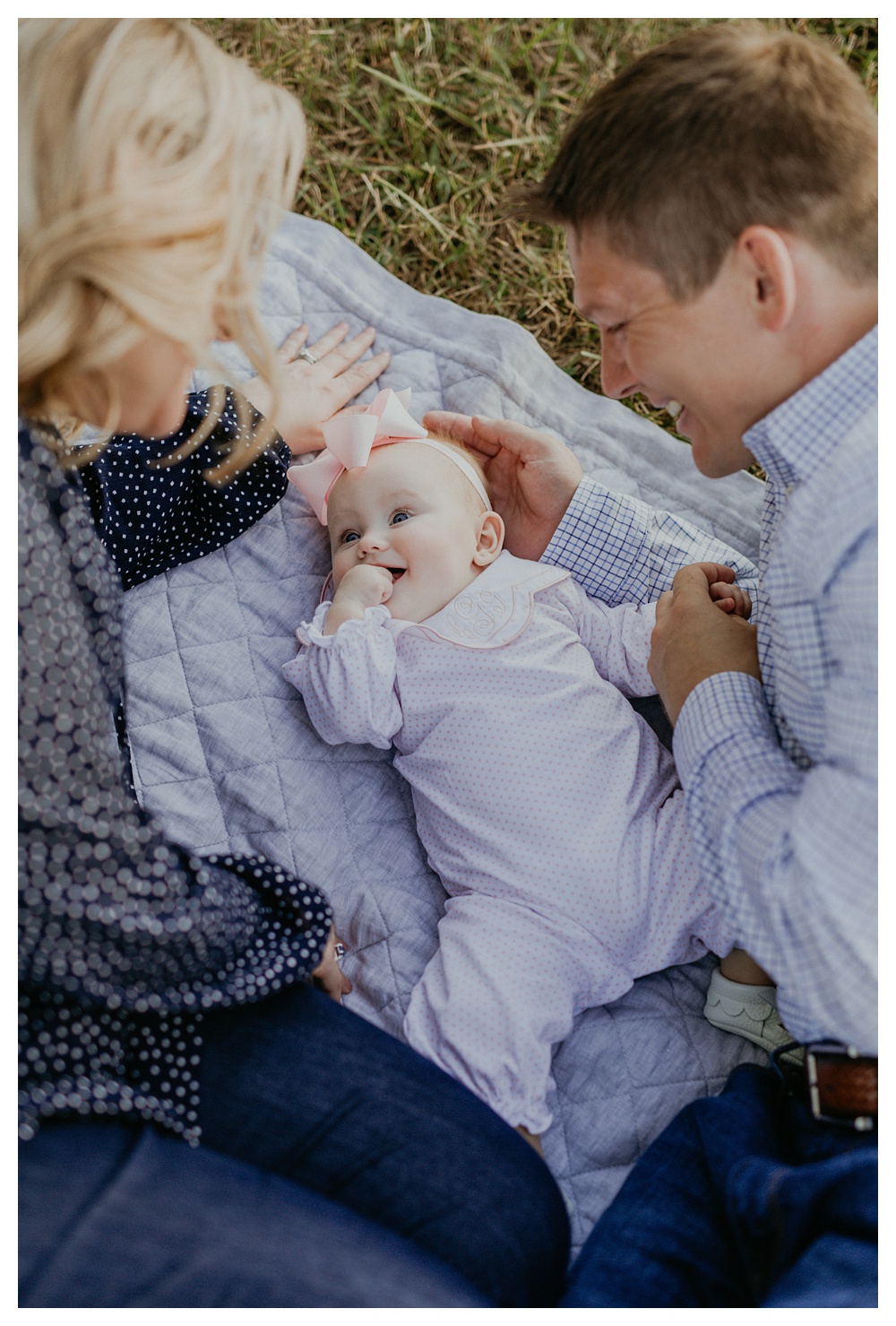 Mom and Dad with baby girl by Nashville family photographer.