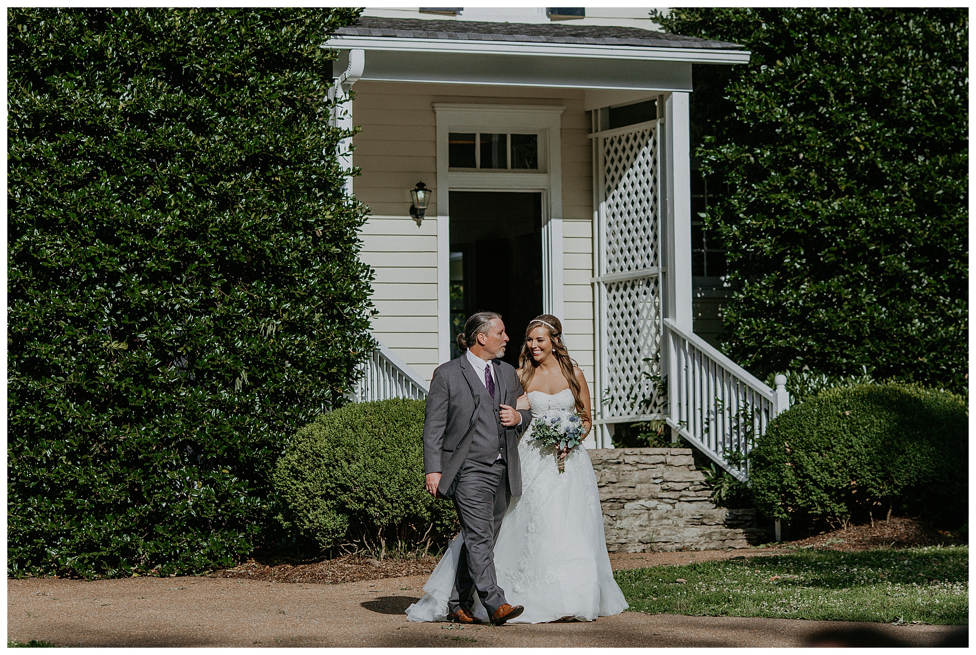 Lauren and her father walk towards the ceremony at the Cool Springs House.