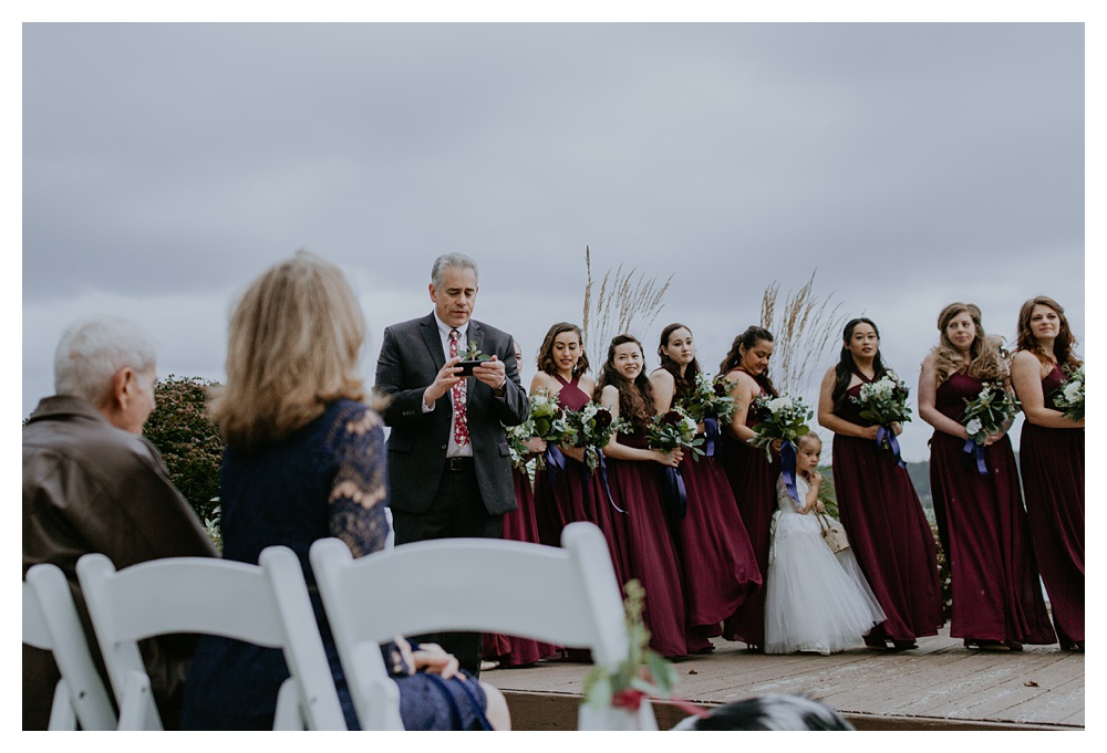 the bride's father talks during the wedding ceremony at Kiana Lodge.
