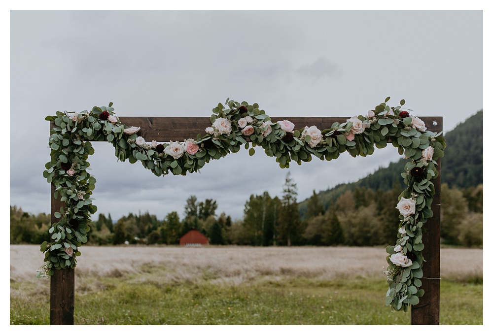 There wedding ceremony arch at Mount Peak Farm in Washington State.Washington State Wedding Photographer, Mount Peak Wedding Venue, PNW Wedding Photographer