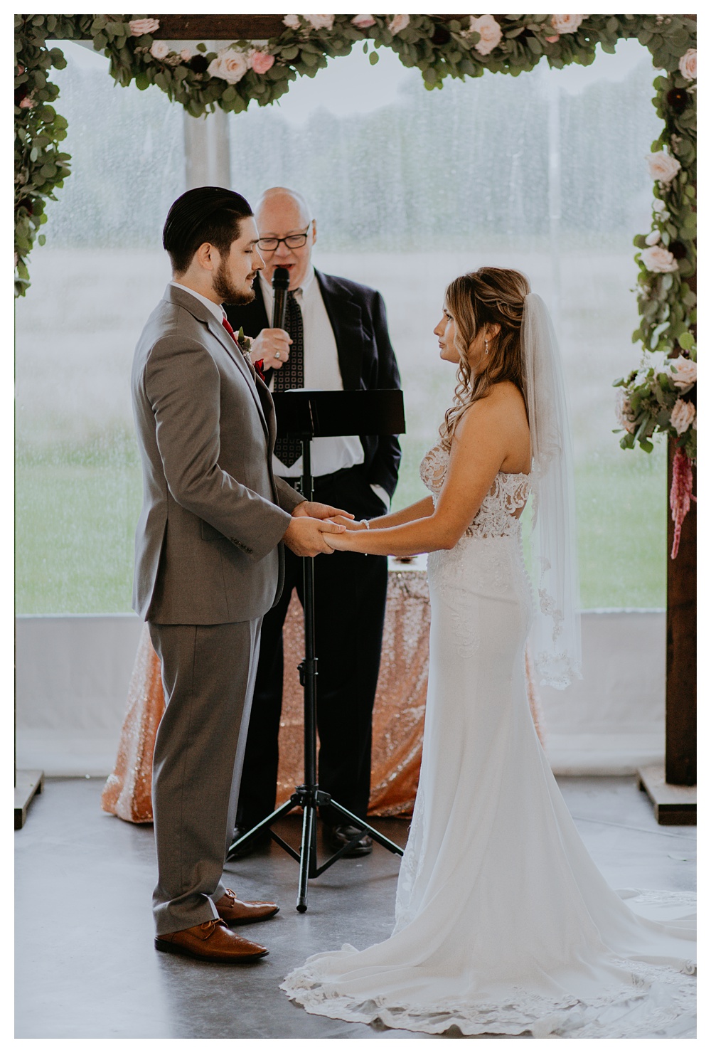 the bride and groom during their wedding ceremony with the pastor at Mount Peak Farm. Washington State Wedding Photographer, Mount Peak Wedding Venue, PNW Wedding Photographer