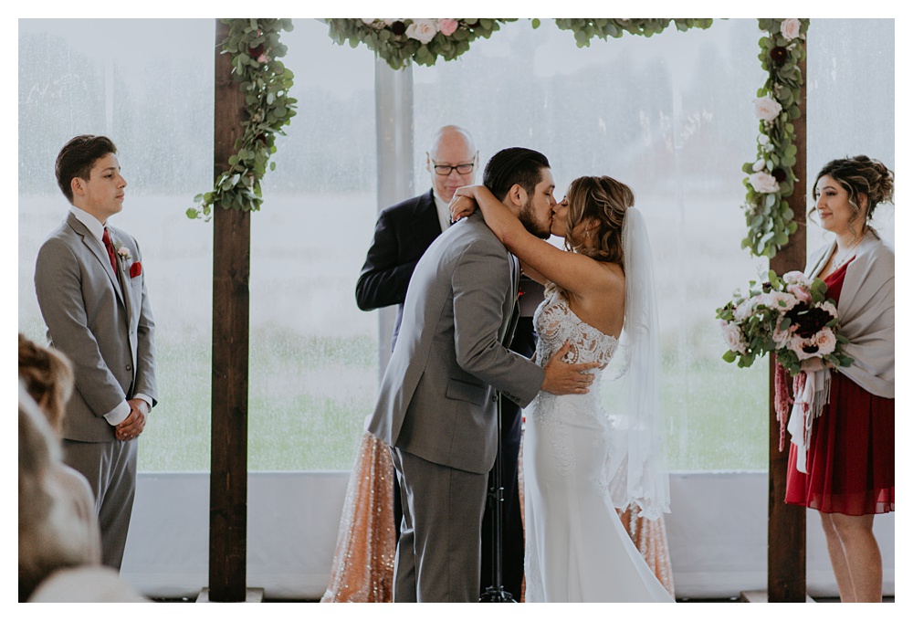 the bride and groom kiss at the end of their ceremony at Mount Peak Farm in Washington State. Washington State Wedding Photographer, Mount Peak Wedding Venue, PNW Wedding Photographer