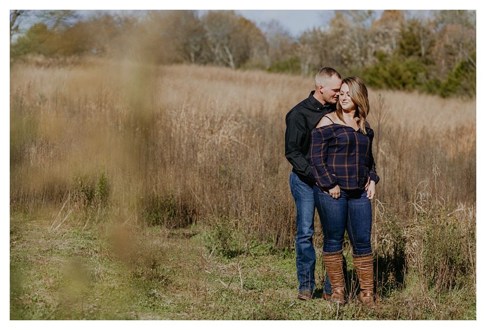 engaged couple in open field