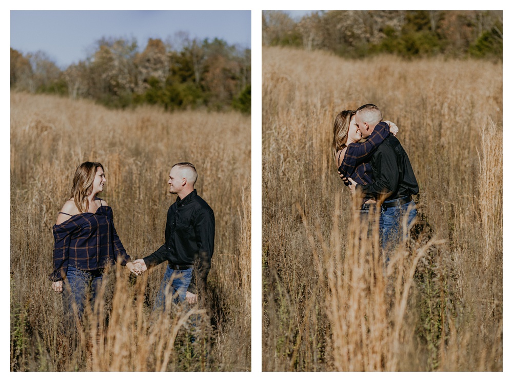 engaged couple kisses in hay field