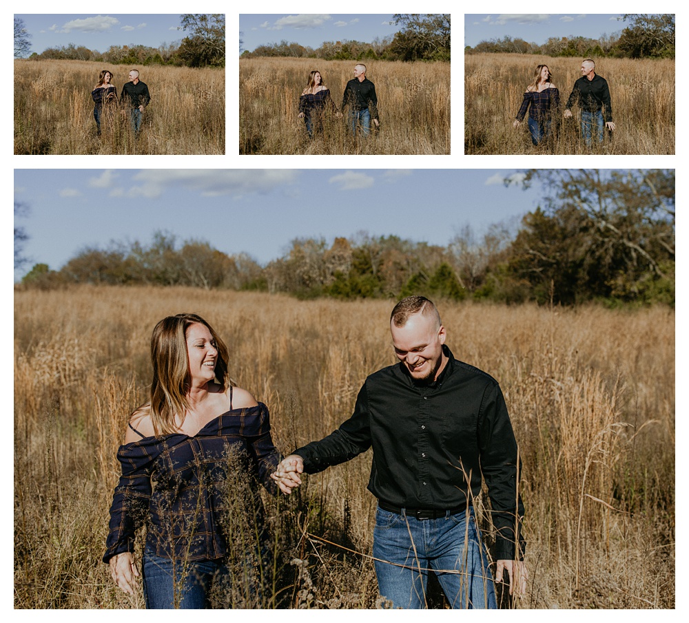 engaged couple run in field