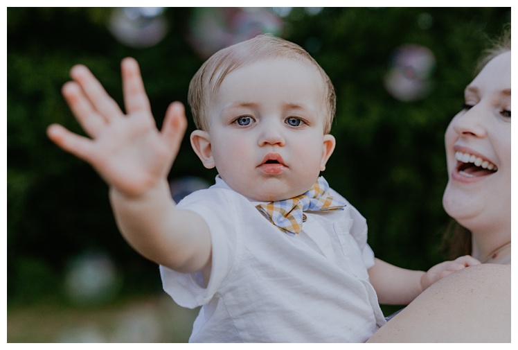 little boy waves, Spring Hill family photographer, Spring Hill Tennessee, Spring Hill Photographer, Franklin Family photographer, Kedron Walking Trail, family photo clothing, family photo ideas, outdoor family photos, park family photos, 