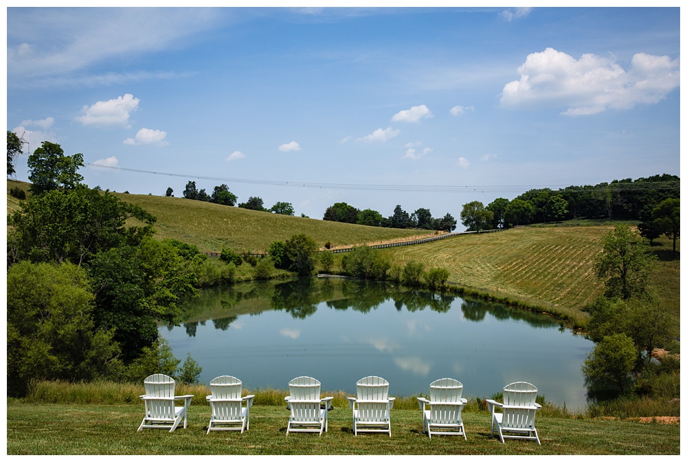 white Adirondack chairs sit beside a pond, Cottage at the ridge, Spring Hill Tennessee, Nashville Family Photographer, Nashville Elopement Photographer, Nashville Wedding Photographer, Nashville wedding photographer, places in Tennessee to elope, Spring Hill Air BnB, Nashville retreat location, Tennessee family vacation