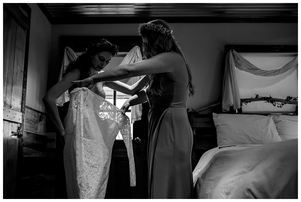 maid of honor helping the bride get into her wedding dress, nashville wedding photographer, nashville wedding, nashville Tennessee wedding, intimate wedding, bohemian wedding, intimate bohemian wedding, intimate nashville wedding, intimate mountain wedding, intimate backyard wedding, intimate elopement, Tennessee elopement