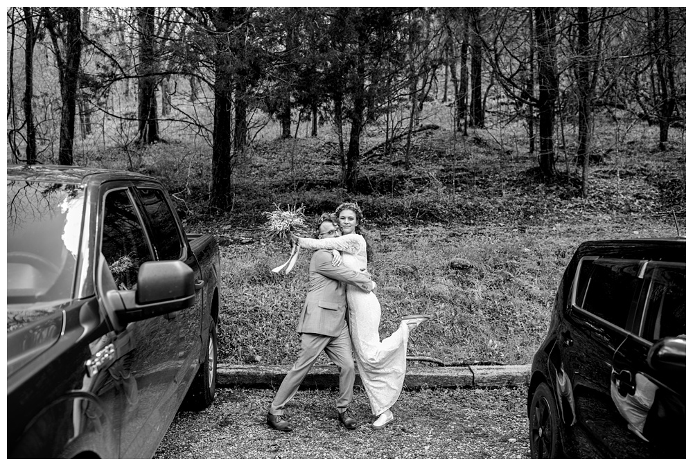 bride and groom hugging and posing between cars immediately after the ceremony, nashville wedding photographer, nashville wedding, nashville Tennessee wedding, intimate wedding, bohemian wedding, intimate bohemian wedding, intimate nashville wedding, intimate mountain wedding, intimate backyard wedding, intimate elopement, Tennessee elopement