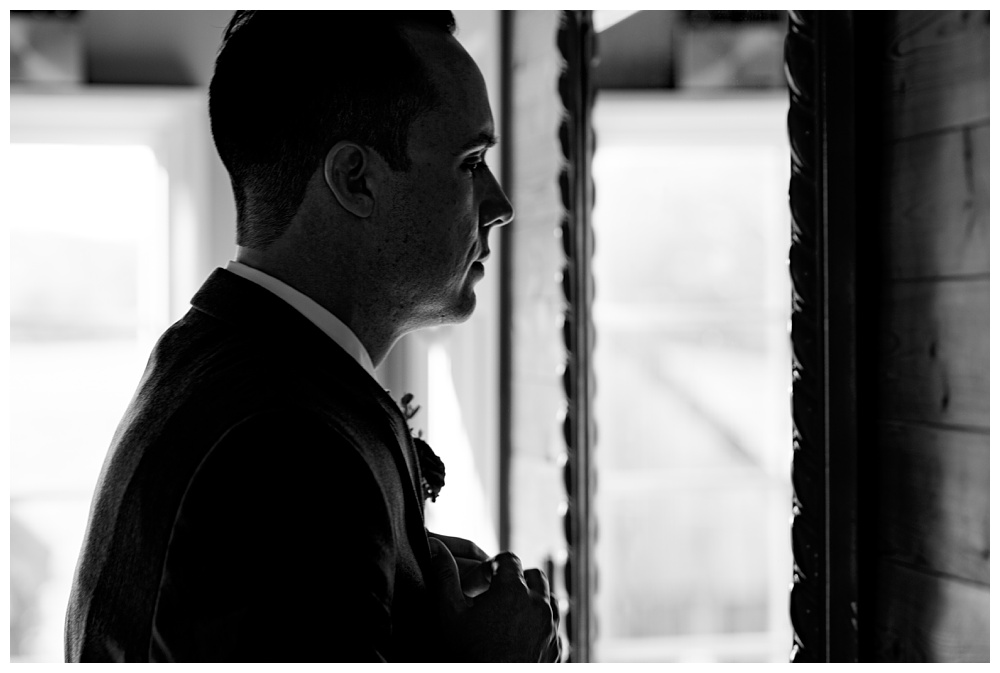 the groom getting ready while looking in the mirror, nashville wedding photographer, nashville wedding, nashville Tennessee wedding, intimate wedding, Drakewood Farm, intimate nashville wedding, intimate outdoor wedding, intimate backyard wedding, intimate elopement, Tennessee elopement