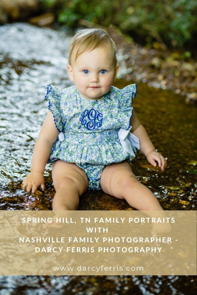Toddler girl sits in the middle of a creek looking at the camera, Nashville family photographer, Spring Hill Tennessee, Spring Hill portrait photographer, Family in Spring Hill, Spring Hill photographer, Spring Hill Family, Nashville film, Nashville lifestyle photographer, luxury family photographer