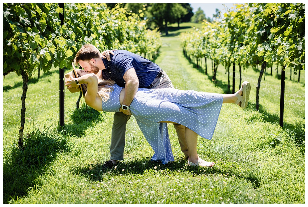 Man dips and kisses his bride to be at Arrington Vineyards after he proposes, nashville proposal photographer, surprise proposal, arrington vineyards, Tennessee winery, best surprise proposal photographer, best Nashville Photographer, best Nashville proposal photographer, Tennessee photographer, couples photographer,