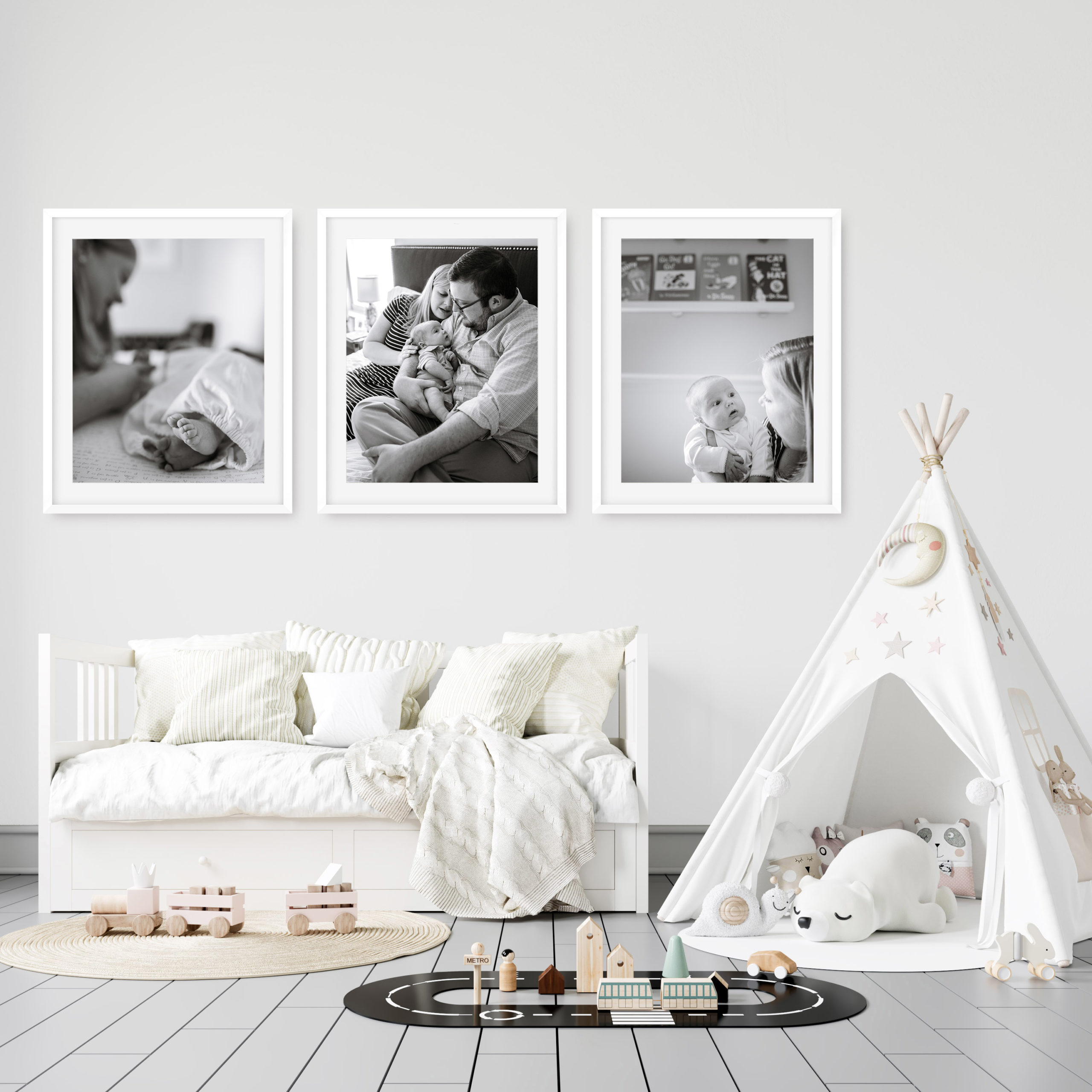 Three large framed vertical images in a baby nursery