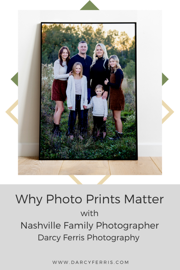 A large framed print of a family standing in the middle of a field - why photo prints matter